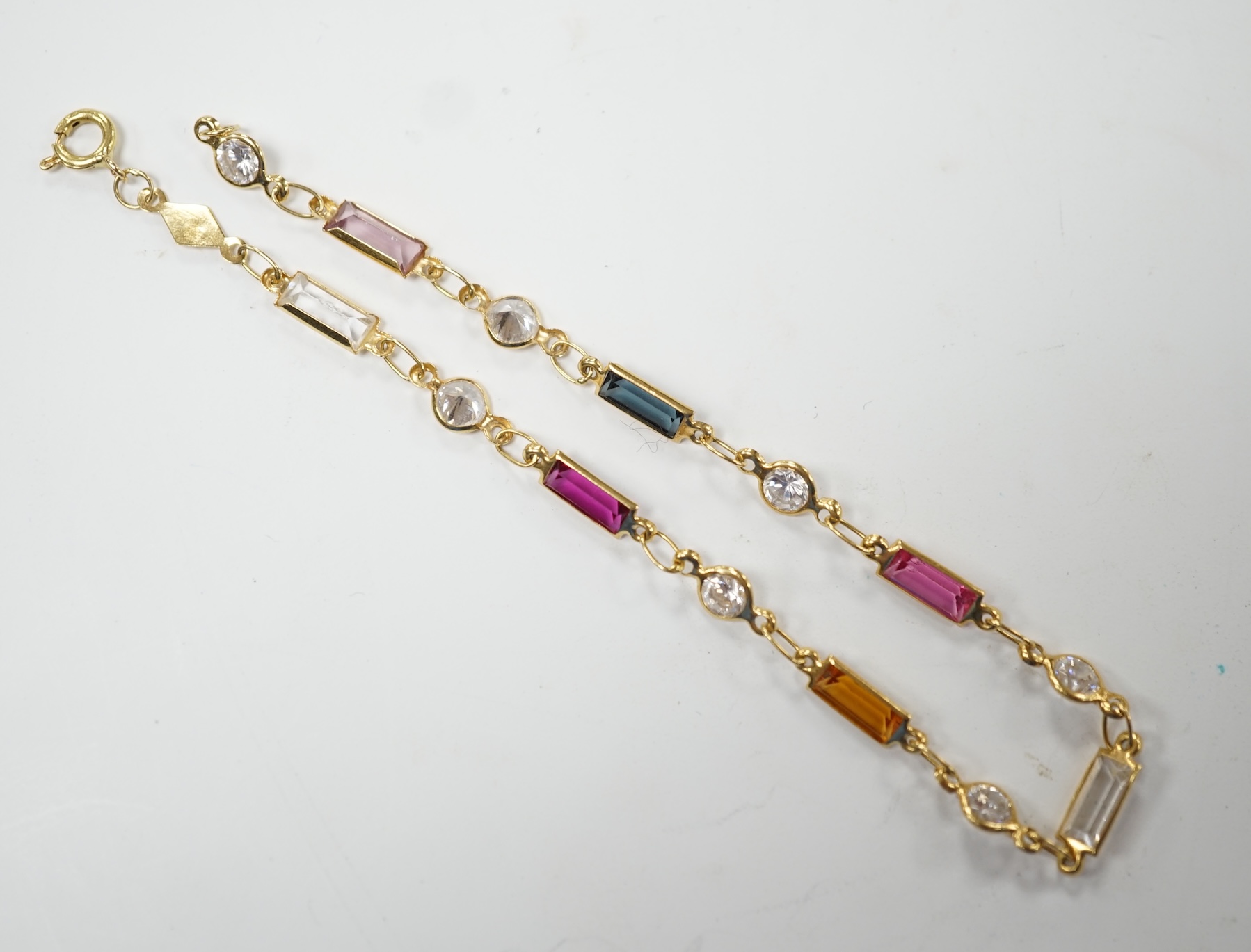 A modern 750 yellow metal and multi-gem set bracelet, 18.5cm, gross weight 2.7 grams. Fair condition
